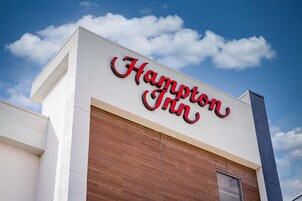 A building with a sign reading 'Hampton Inn.'