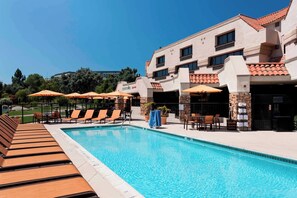 Outdoor pool, open 8:00 AM to 8:00 PM, pool umbrellas