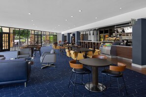 Relax and socialize in this inviting space with comfortable seating and a mix of contemporary and classic styles.