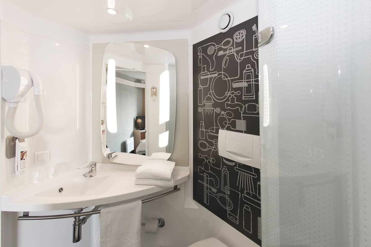 shower, eco-friendly toiletries, hair dryer, towels