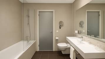 Suite Signature | Bathroom | Free toiletries, hair dryer, bathrobes, slippers