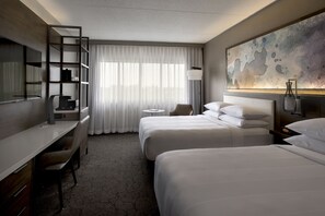Premium bedding, desk, laptop workspace, blackout drapes