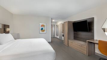 Premium bedding, desk, laptop workspace, iron/ironing board