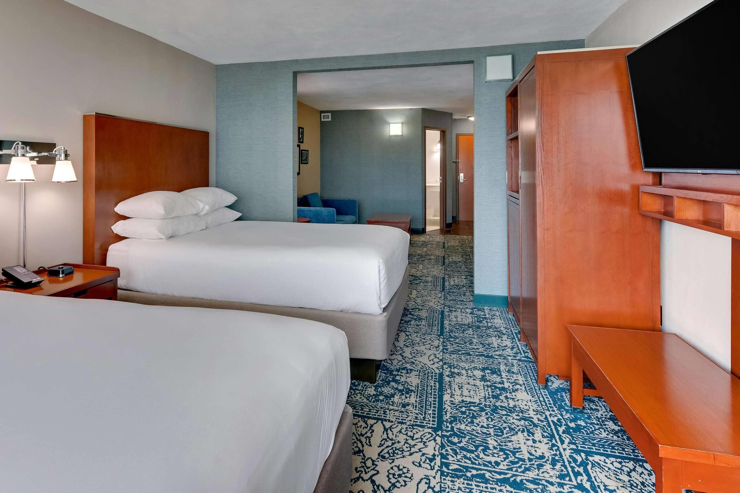 Suite, 2 Queen Beds, Non Smoking | Desk, laptop workspace, blackout drapes, iron/ironing board