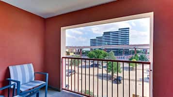 Desk, laptop workspace, blackout drapes, iron/ironing board