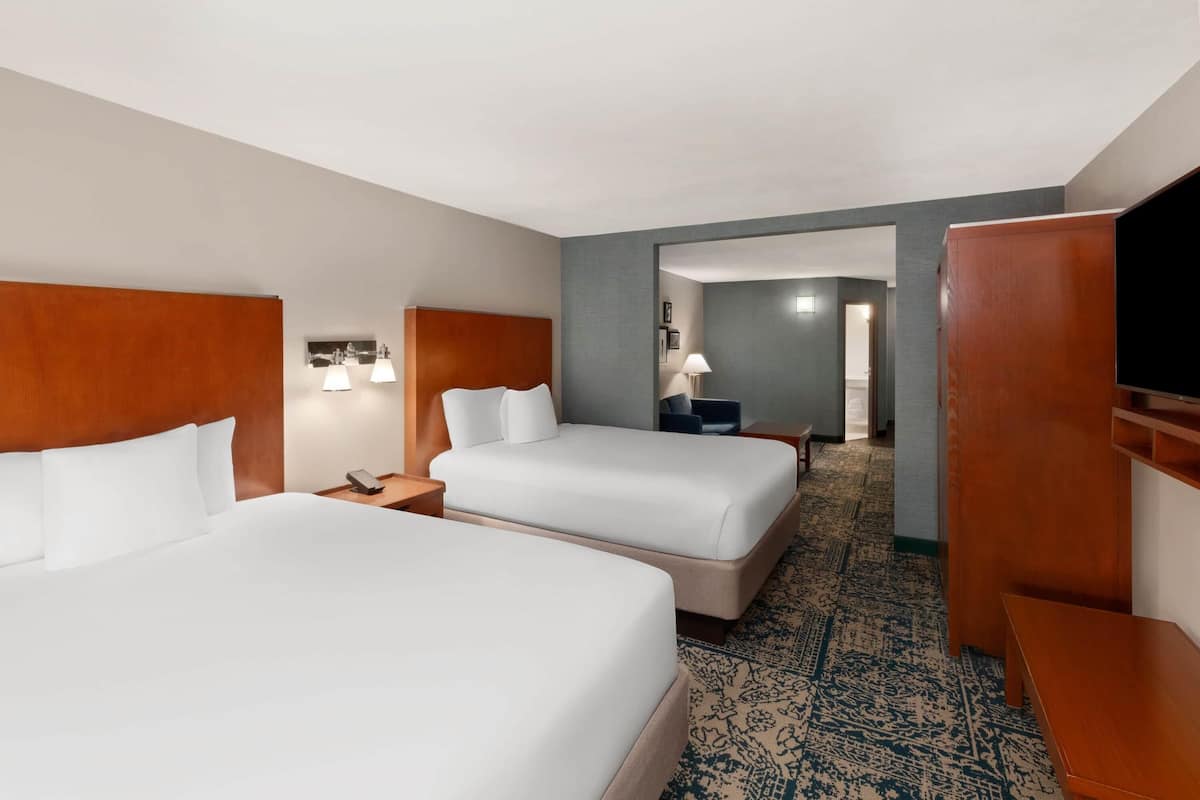 Suite, 2 Queen Beds, Non Smoking | Desk, laptop workspace, blackout curtains, iron/ironing board