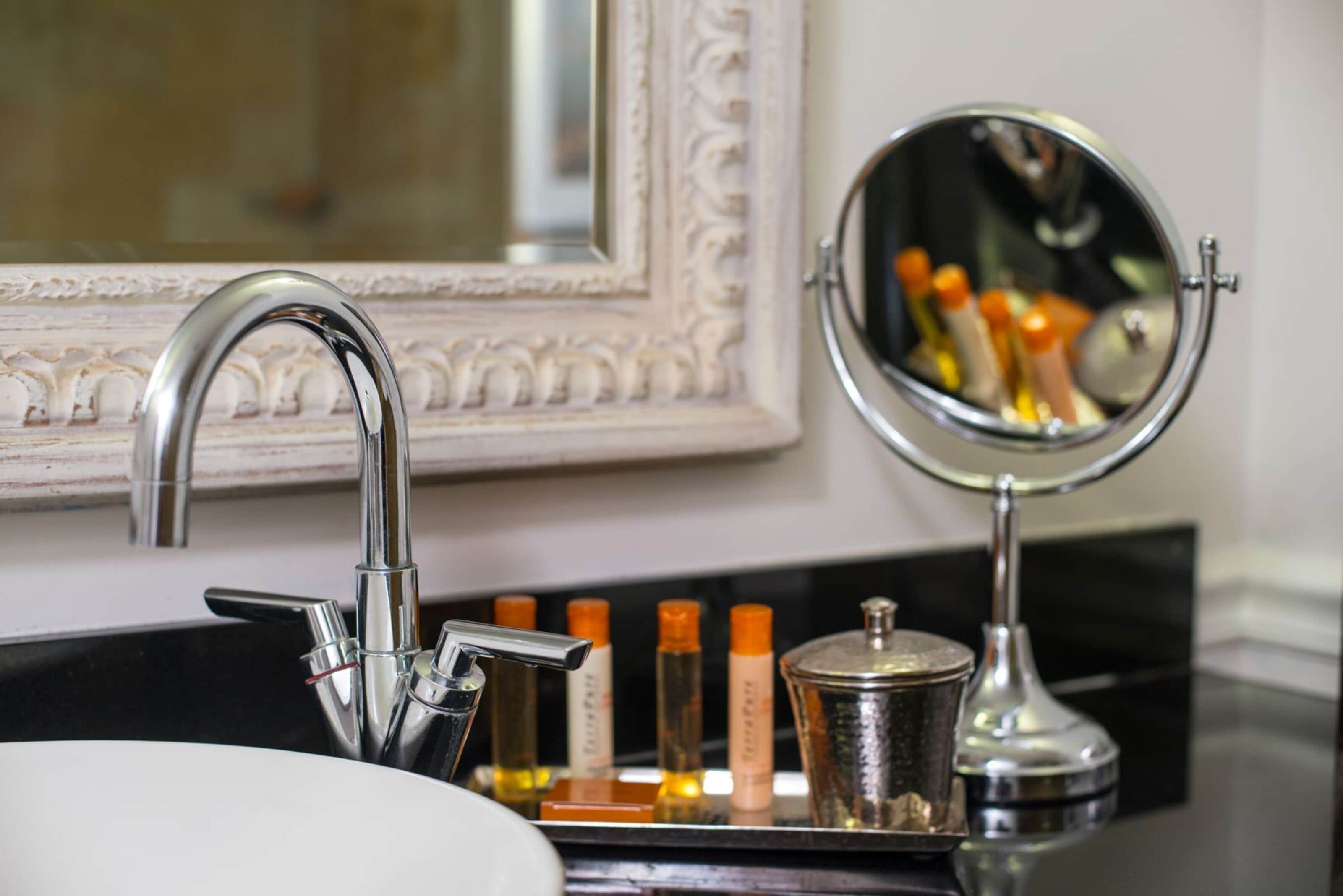 combined shower/bathtub, designer toiletries, hair dryer, towels