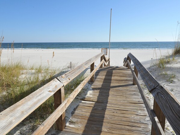 On the beach, white sand, sun-loungers, beach umbrellas