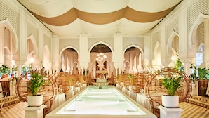 A luxurious hotel lobby with a central fountain, ornate arches, and wicker furniture. - Krystal Ixtapa All Inclusive (Ixtapa)