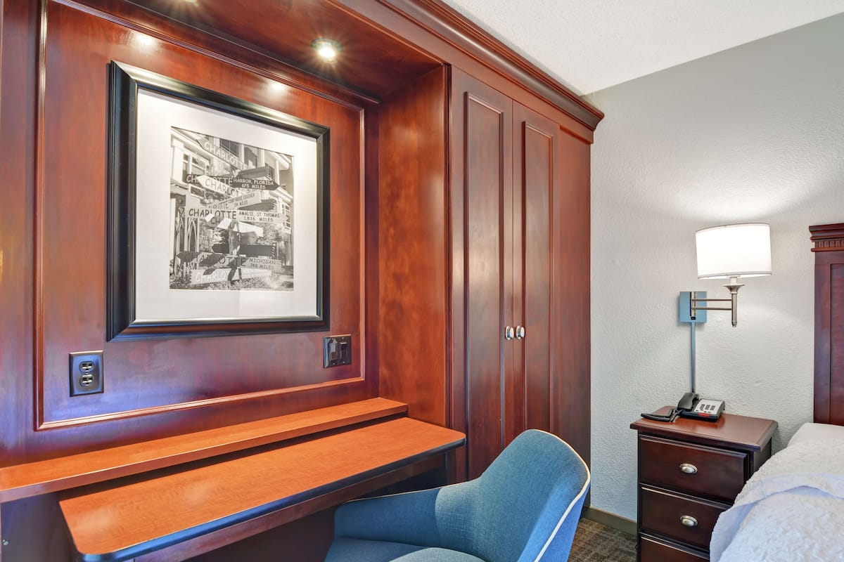 Premium bedding, pillow-top beds, laptop workspace, blackout curtains