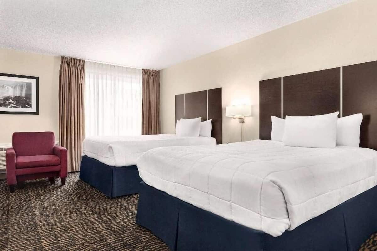 Pillow-top beds, desk, blackout curtains, iron/ironing board