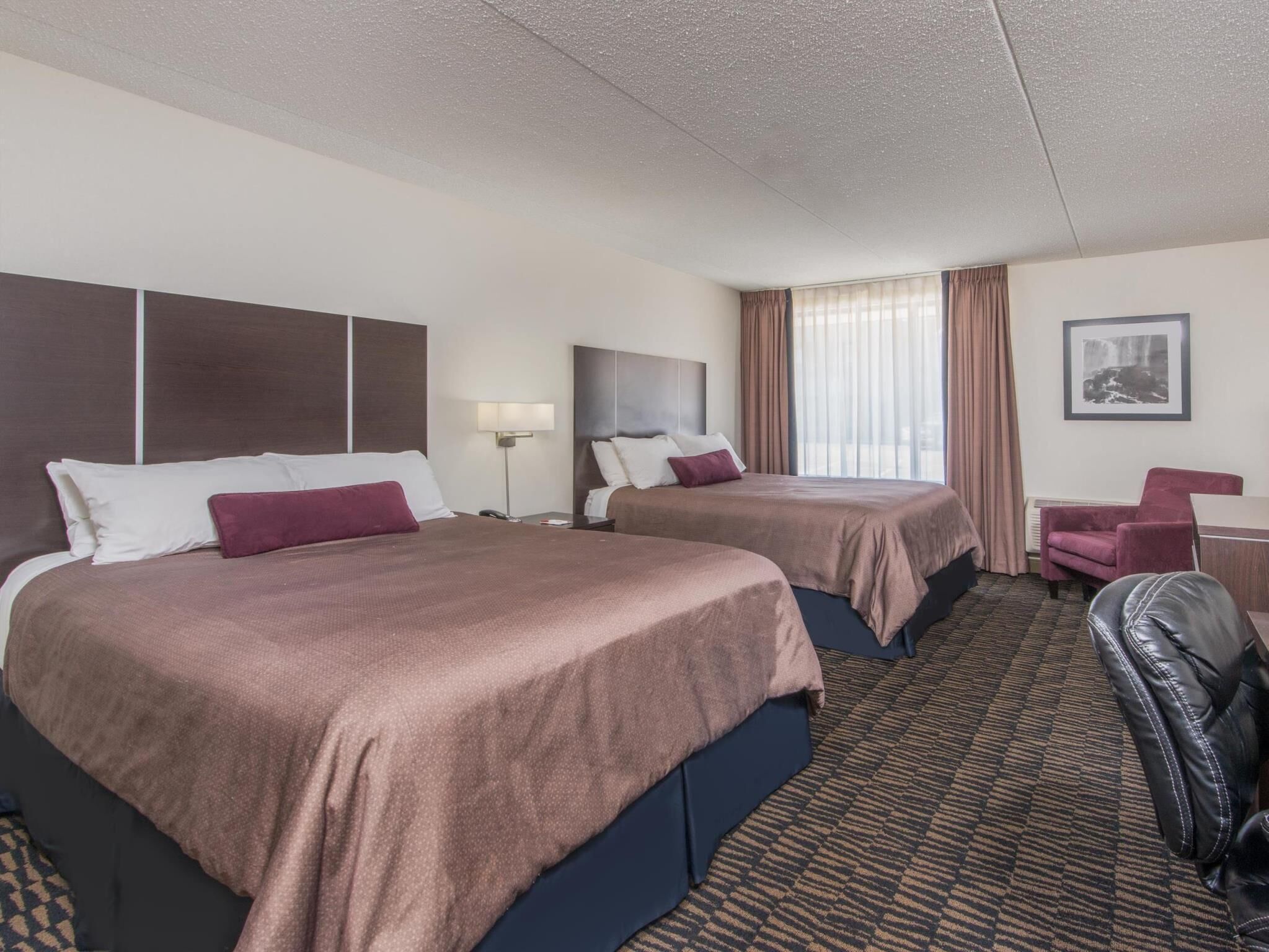 Pillowtop beds, desk, blackout drapes, iron/ironing board