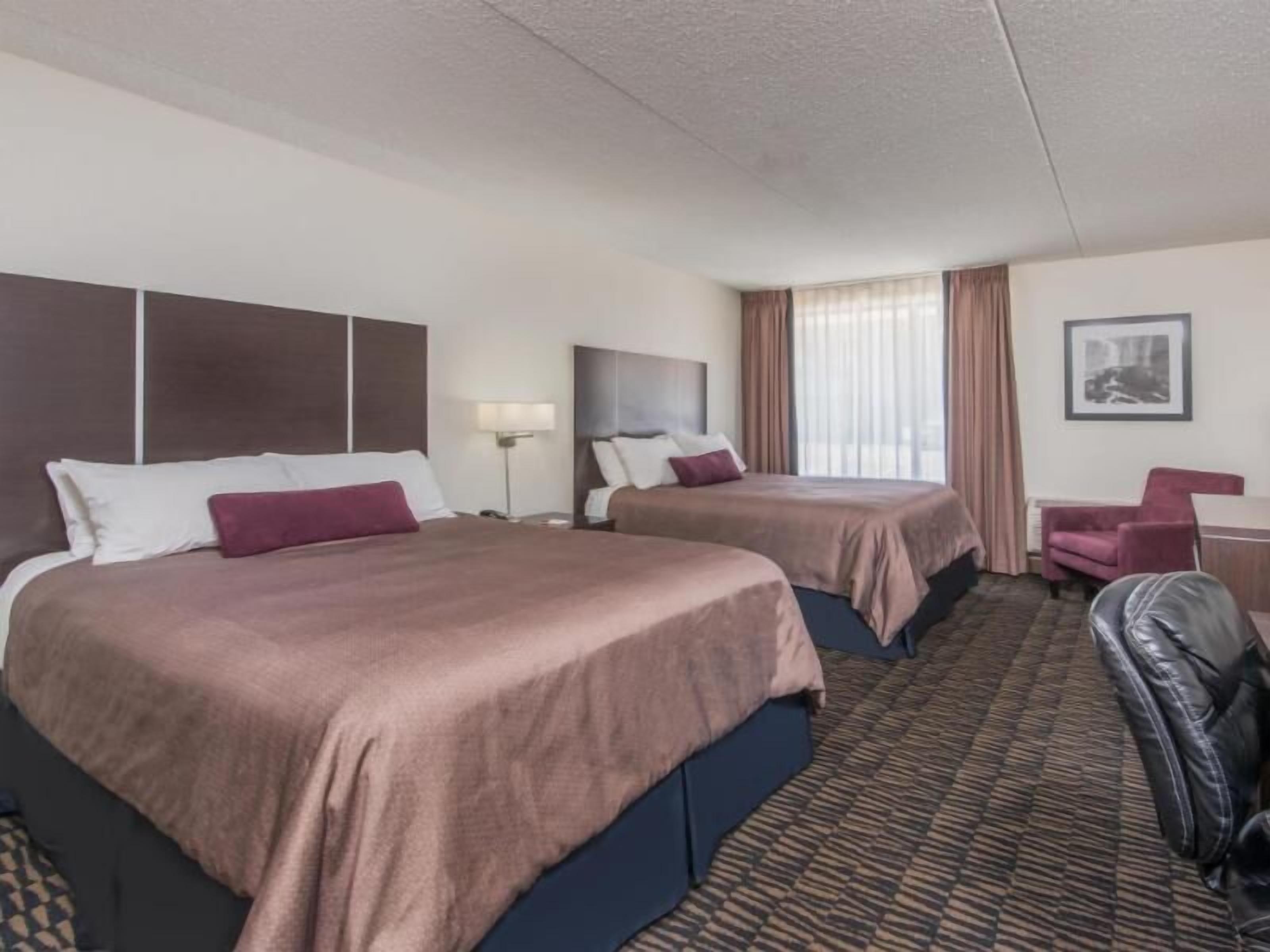 Pillowtop beds, desk, blackout drapes, iron/ironing board