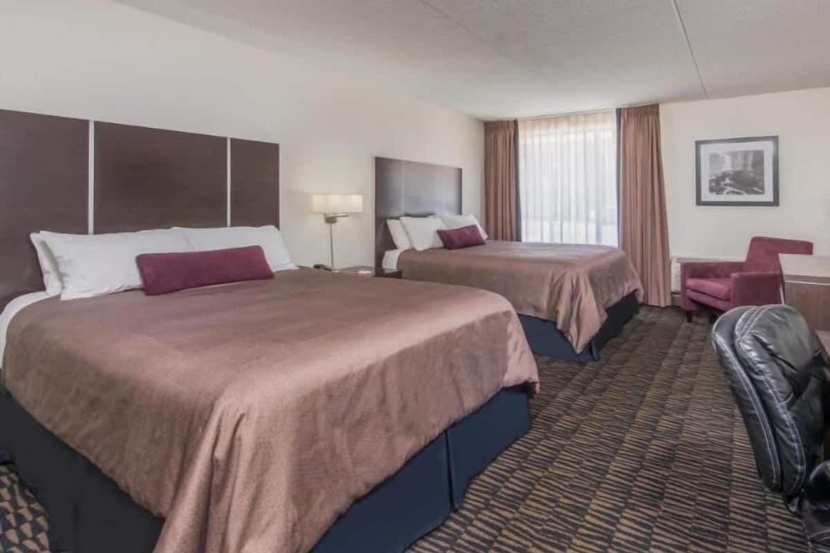 Pillow-top beds, desk, blackout curtains, iron/ironing board