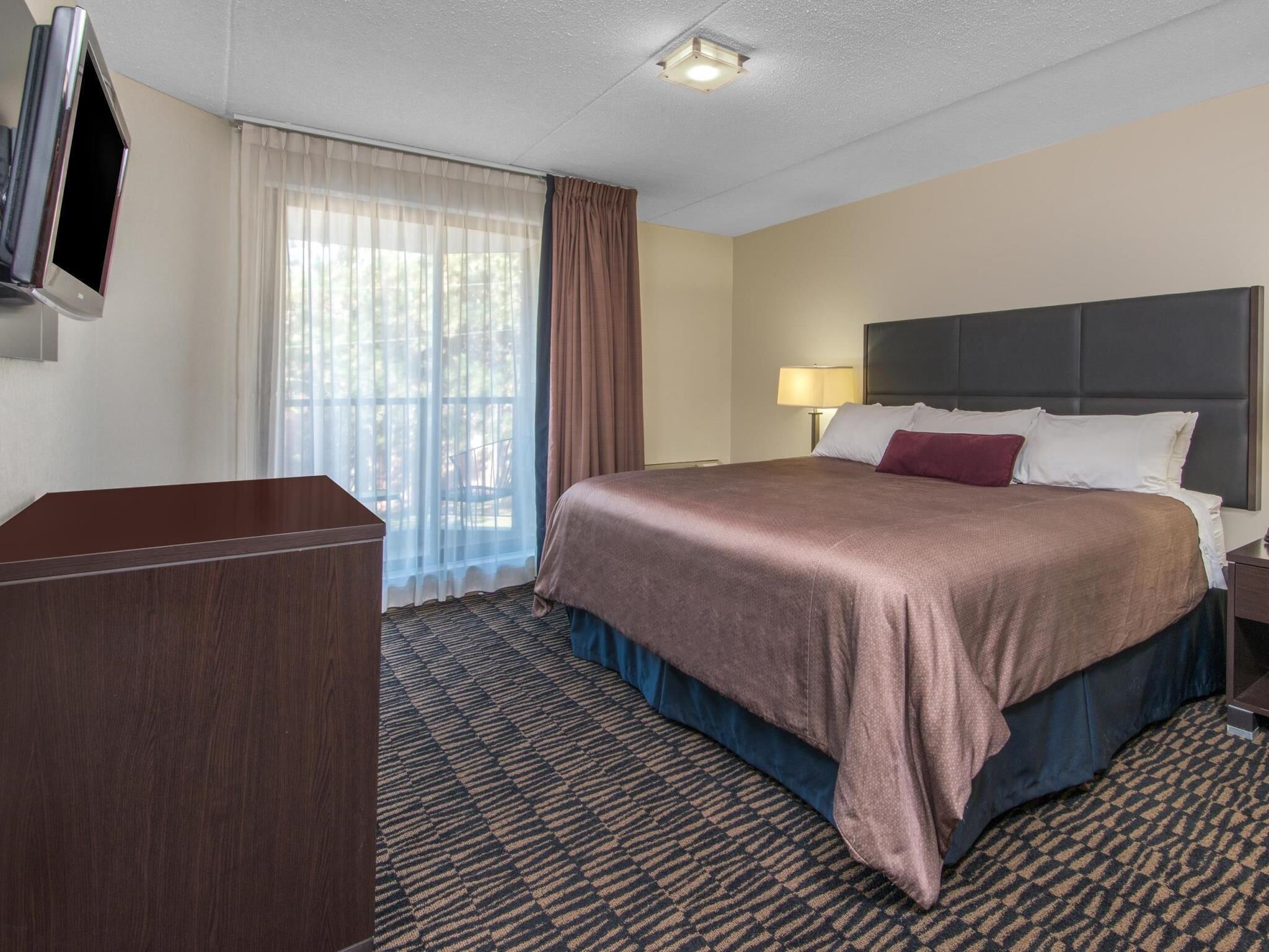 Pillowtop beds, desk, blackout drapes, iron/ironing board