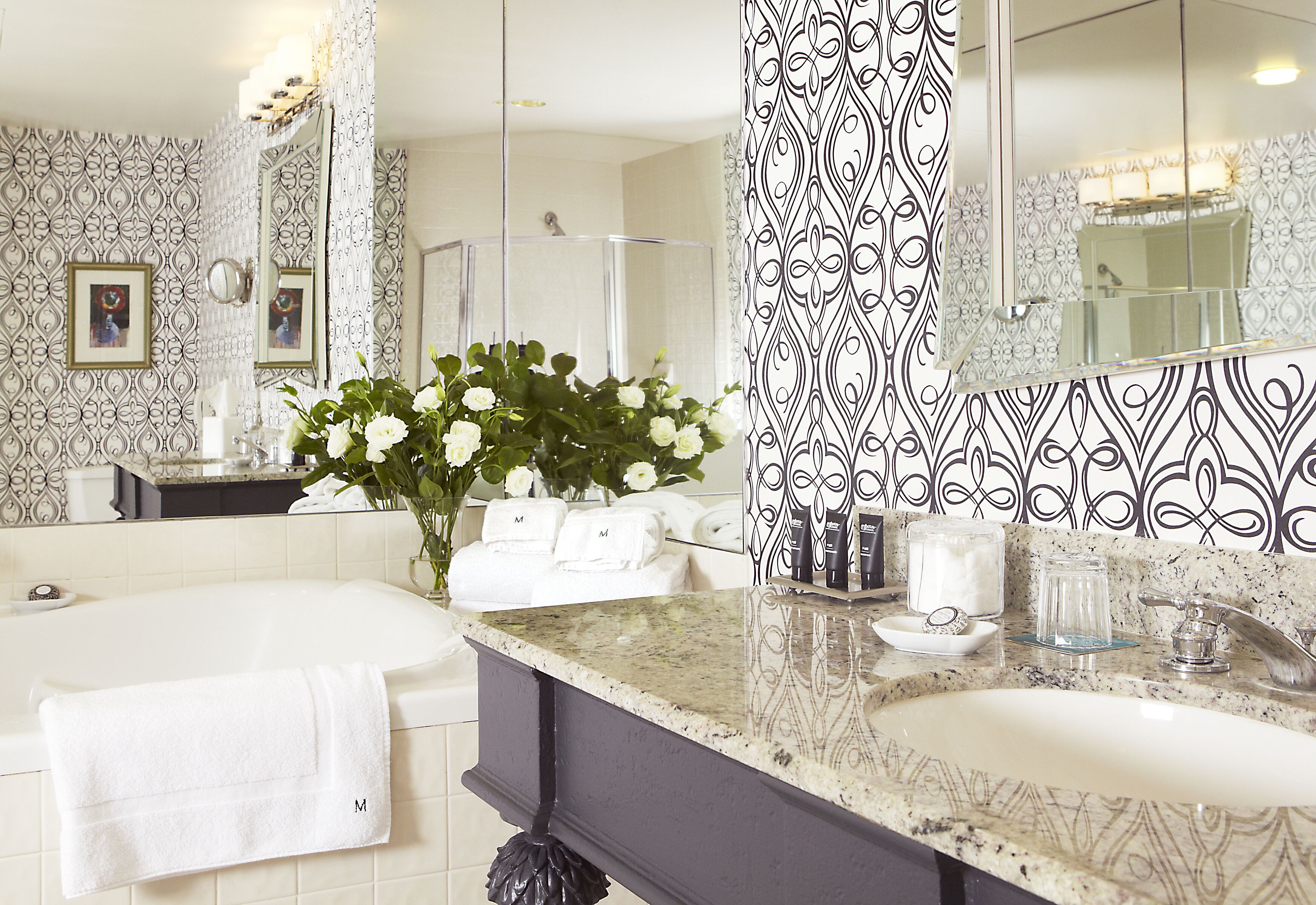 designer toiletries, hair dryer, towels, soap