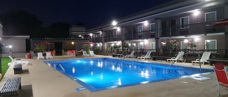 Seasonal outdoor pool, open 10:00 AM to 10:00 PM, pool umbrellas