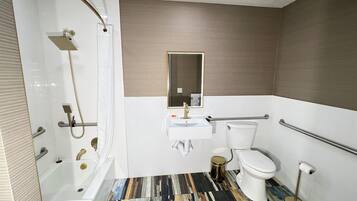 Deluxe Suite, 1 King Bed with Sofa bed, Accessible Bathtub | Bathroom | Combined shower/bathtub, free toiletries, hair dryer, towels