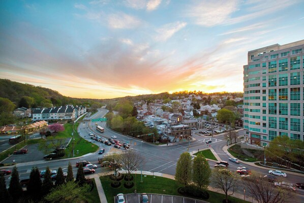 A cityscape with a modern building, a roundabout, and surrounding residential areas. - Marriott Philadelphia West (Conshohocken)