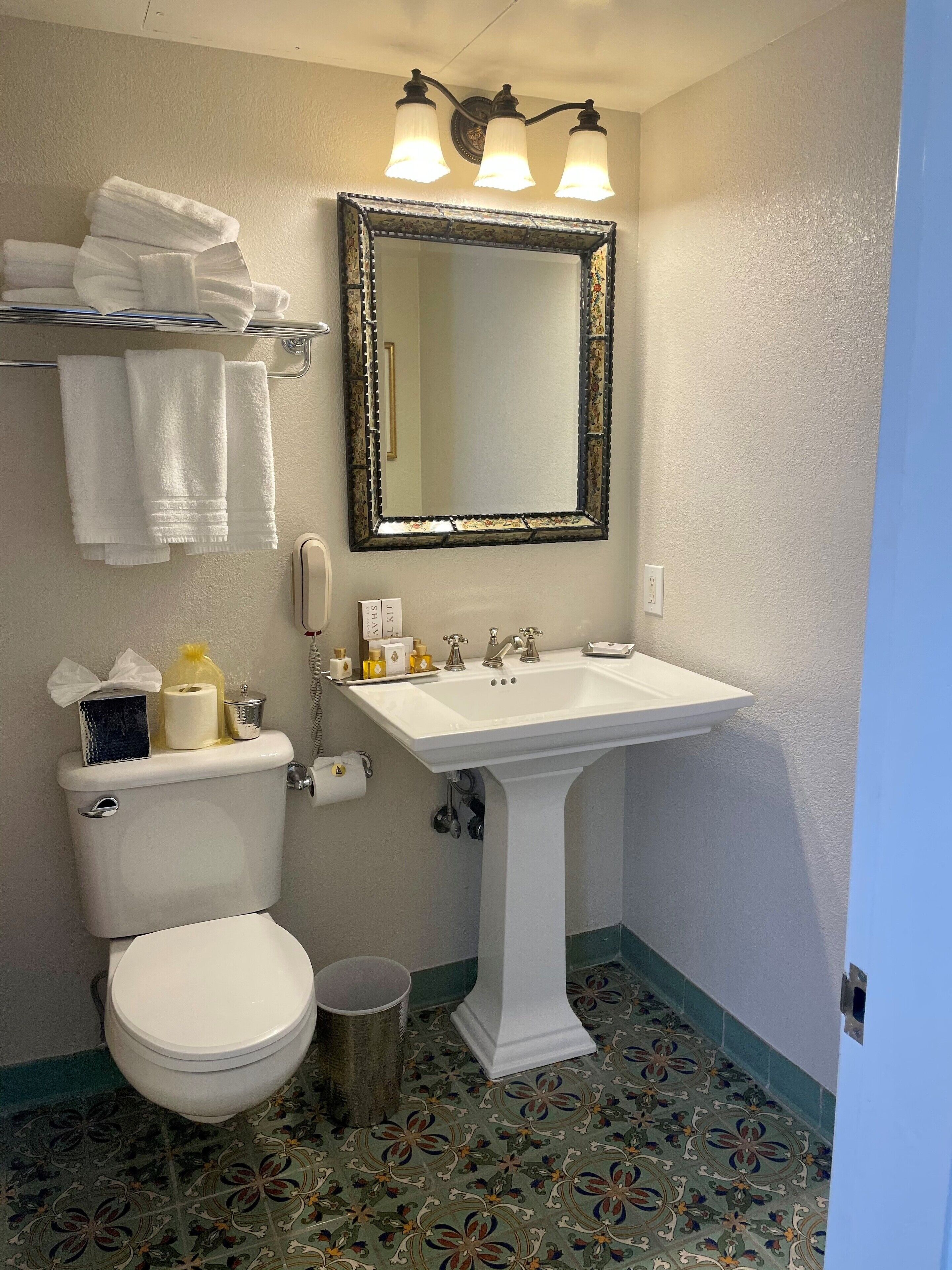 combined shower/bathtub, designer toiletries, hair dryer, bathrobes