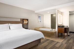 Standard Room, 1 King Bed, Jetted Tub, Pool View | In-room safe, desk, iron/ironing board, cribs/infant beds