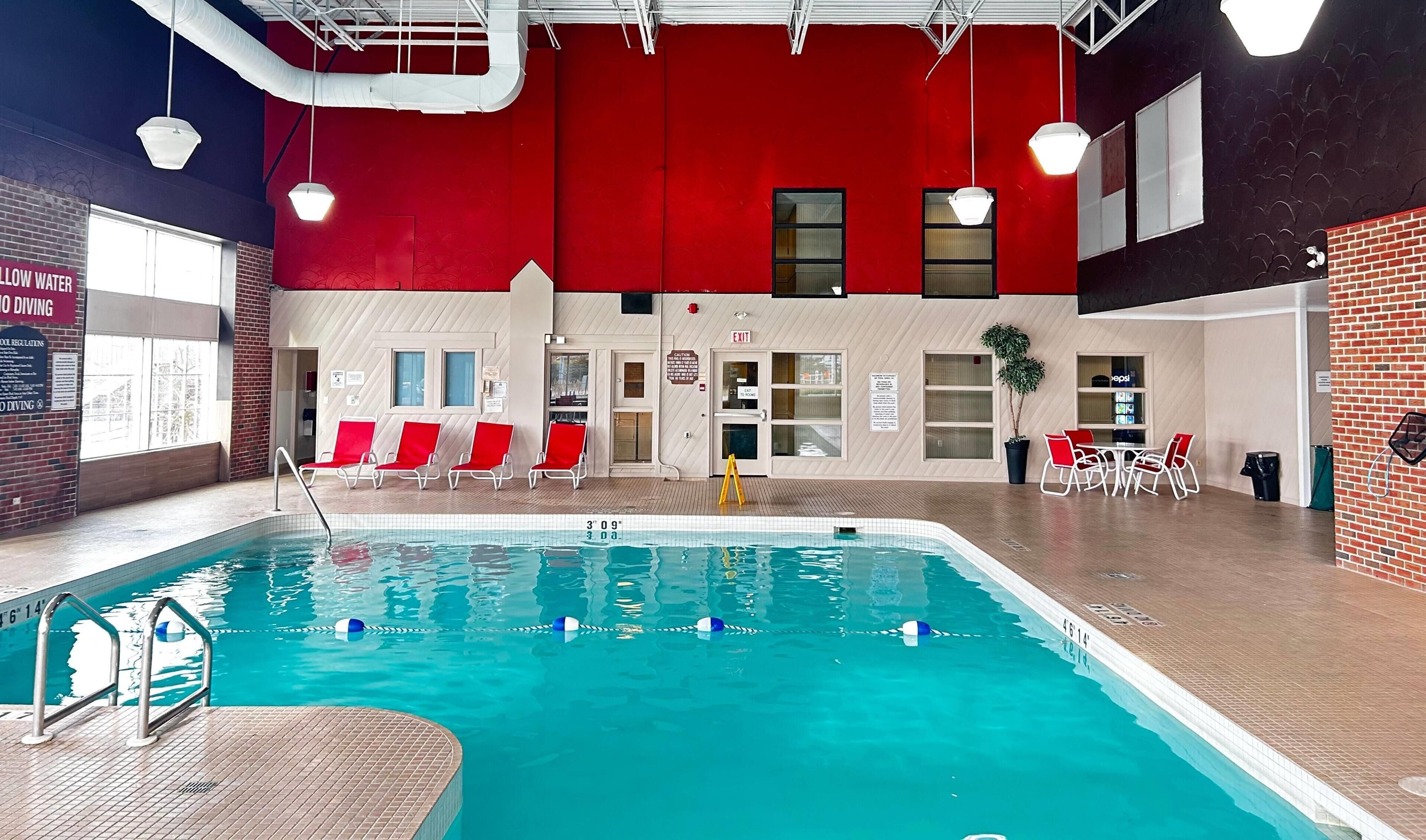 Indoor pool, open 7 AM to 11 PM, sun loungers