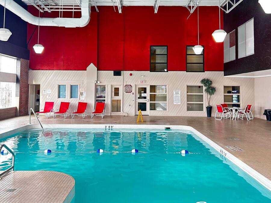 Indoor pool, open 7 AM to 11 PM, pool loungers