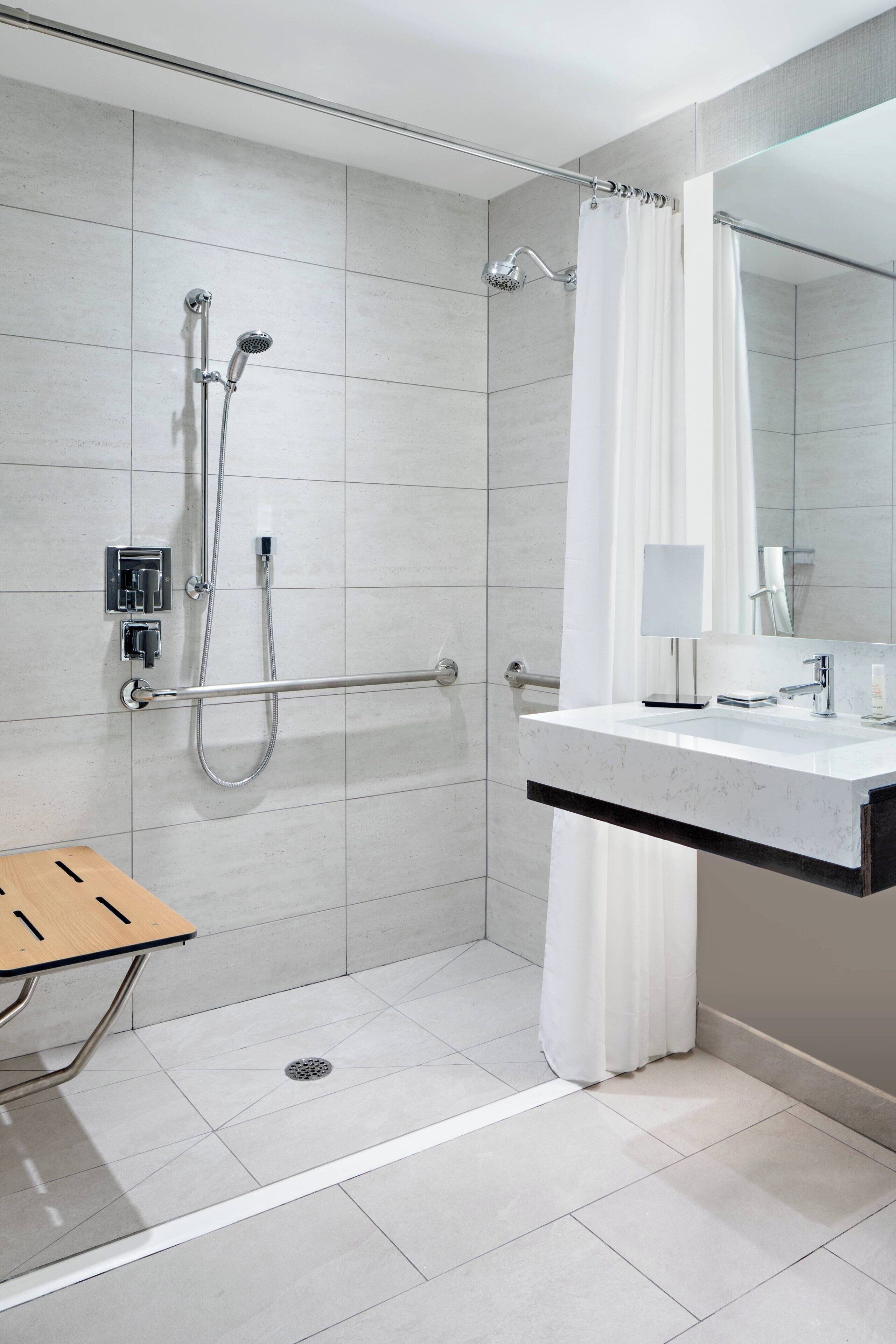 combined shower/bathtub, eco-friendly toiletries, hair dryer, bathrobes
