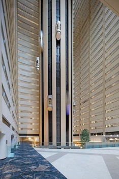 A DJ booth with Pioneer DJ equipment in a crowded indoor event space. at New York Marriott Marquis