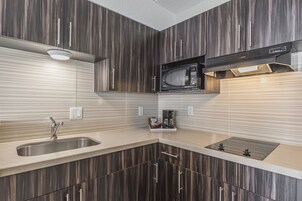 Premium bedding, blackout drapes, iron/ironing board