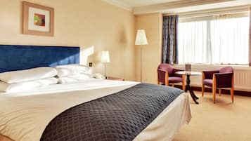 Premium bedding, desk, laptop workspace, soundproofing