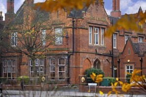 A traditional brick building with arched windows and a sign reading "Plough & Harrow." - Best Western Plough & Harrow Hotel (Birmingham)