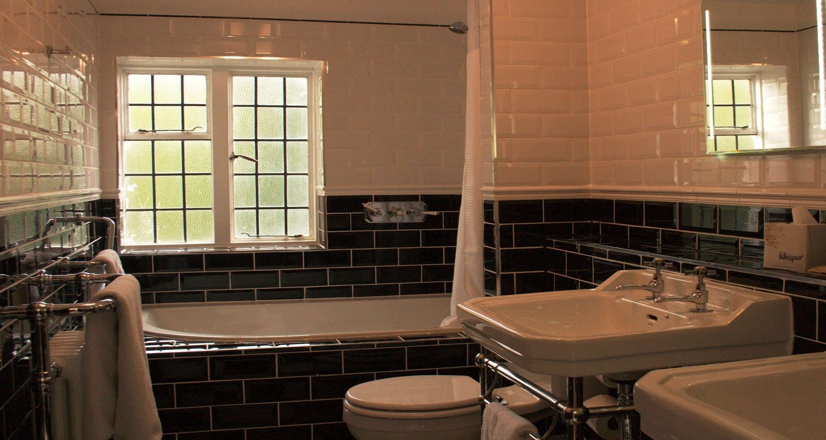 A bathroom with a bathtub, a sink, and a toilet.