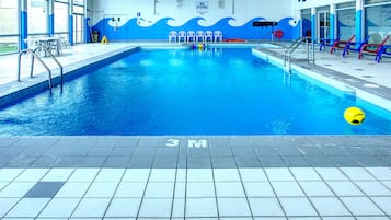 Indoor pool, open 9:00 AM to 10:00 PM, pool loungers