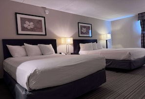 Pillowtop beds, desk, blackout drapes, iron/ironing board