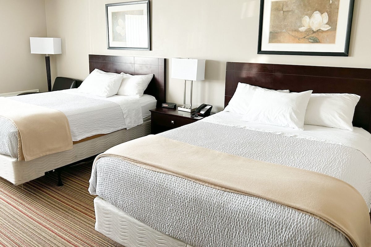 Pillowtop beds, desk, blackout drapes, iron/ironing board