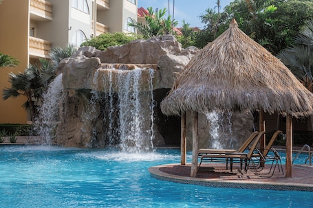 3 outdoor pools, open 10 AM to 10 PM, pool umbrellas, sun loungers. Eagle Aruba Resort