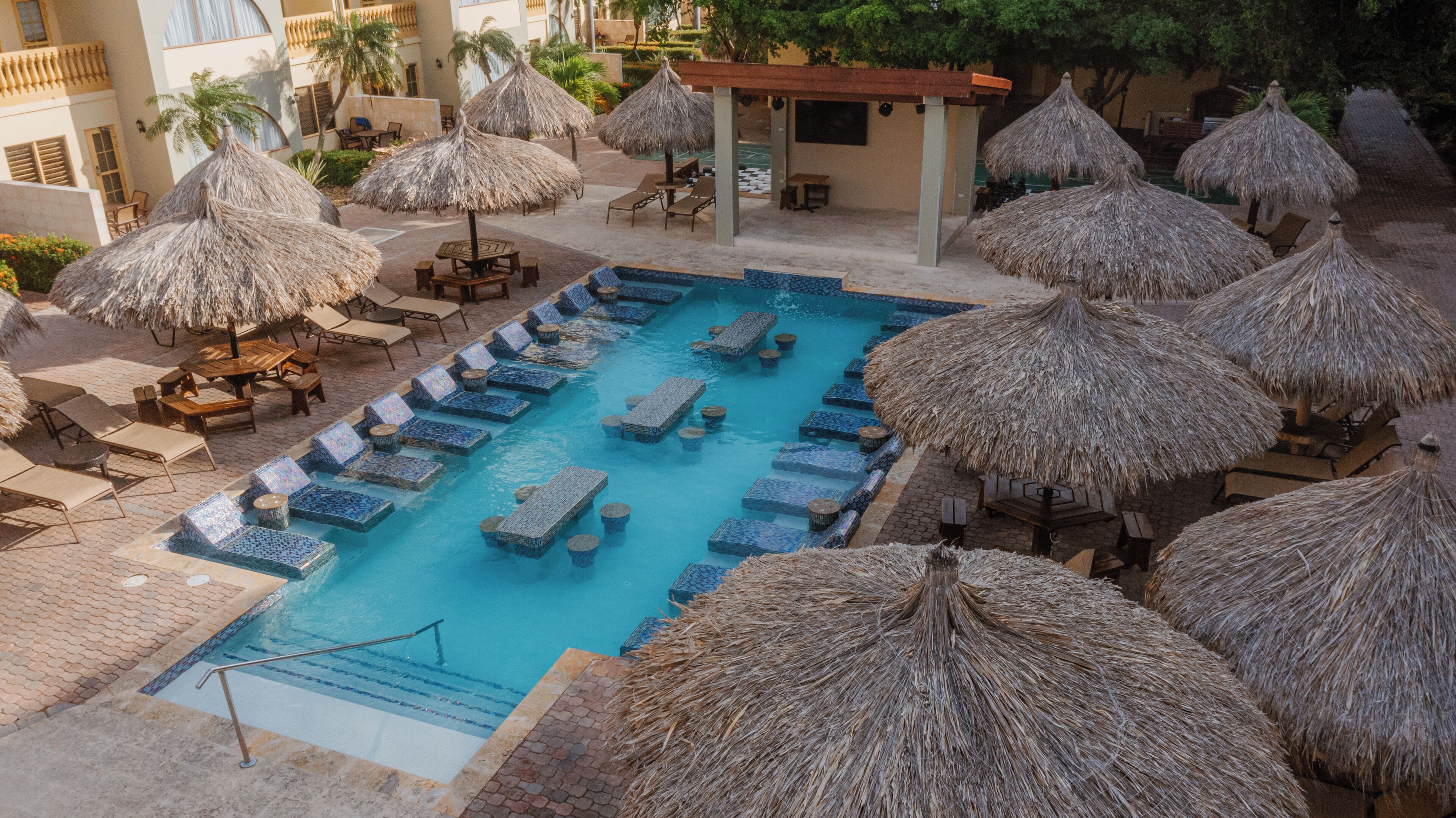 3 outdoor pools, open 10 am to 10 pm, pool umbrellas, pool loungers