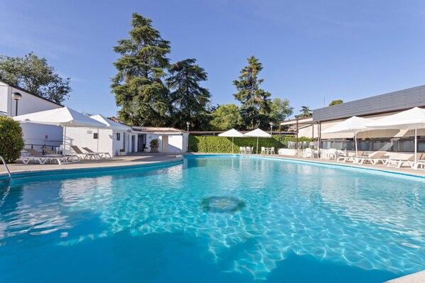Seasonal outdoor pool, pool umbrellas, pool loungers