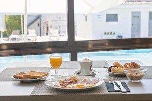 Breakfast, lunch, dinner served; Mediterranean cuisine, pool views 