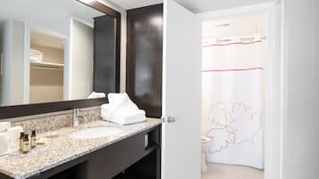 Separate bathtub and shower, towels, soap, shampoo