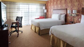 Premium bedding, desk, laptop workspace, blackout drapes