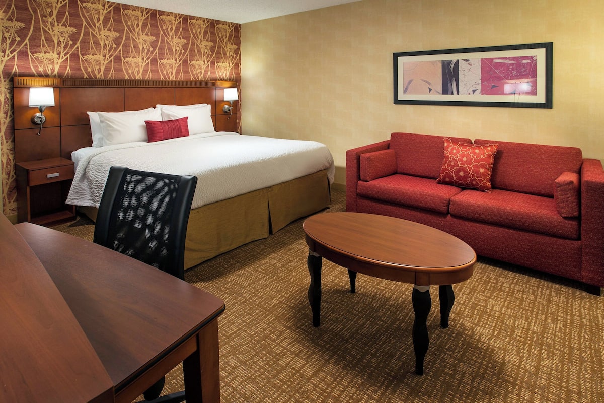 Premium bedding, desk, laptop workspace, blackout drapes