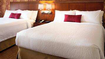 Premium bedding, desk, laptop workspace, blackout drapes