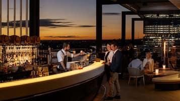 4 bars/lounges, rooftop bar, lobby lounge, pub