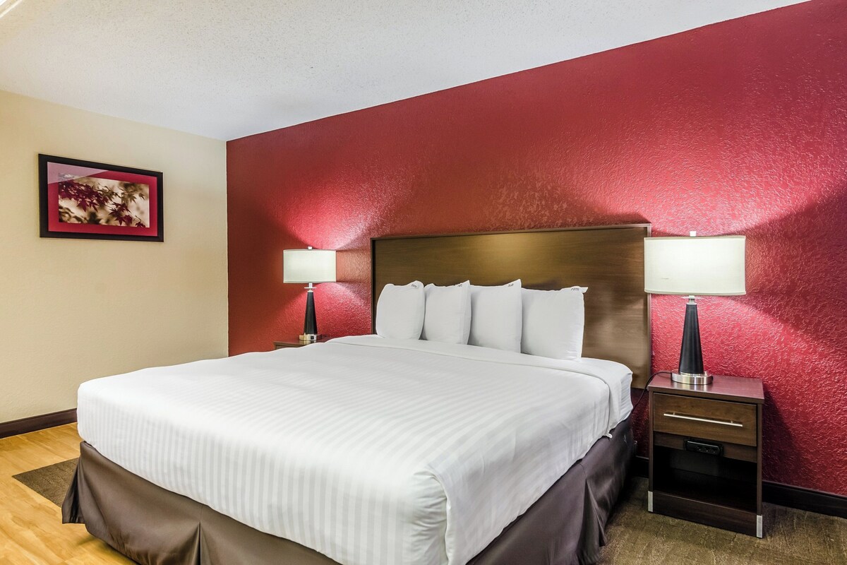 Desk, laptop workspace, blackout drapes, iron/ironing board