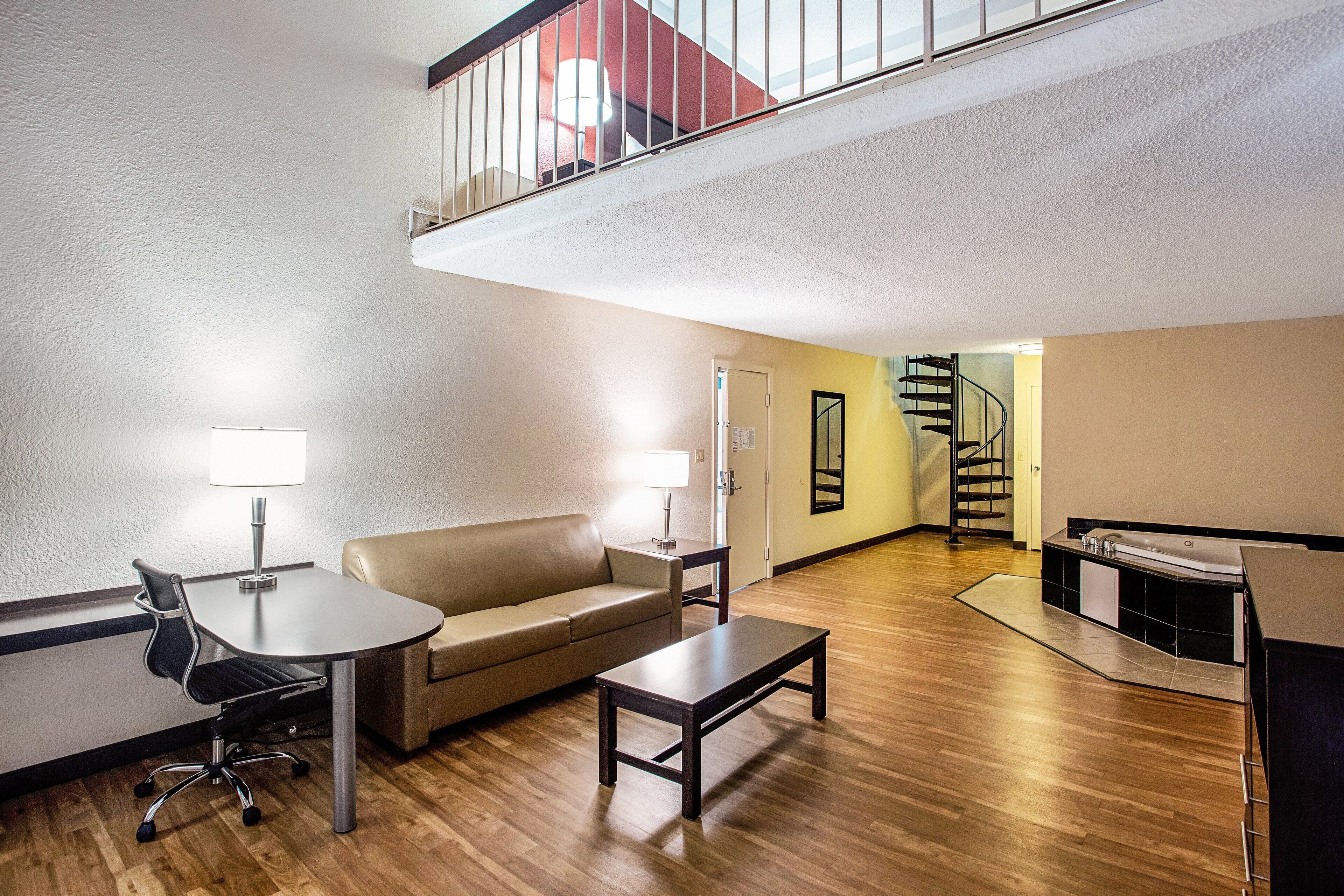 Superior Room, 1 King Bed, Jetted Tub (Loft, Smoke Free) | Desk, laptop workspace, blackout drapes, iron/ironing board