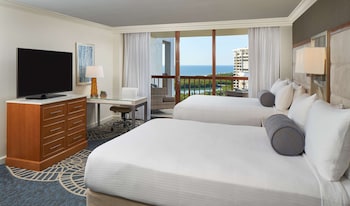 Hotel amenities such as safe, desk and work area at Naples Grande Beach Resort