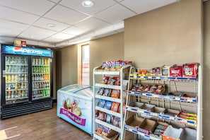 A snack and beverage vending area with a Pepsi cooler and a freezer. - Red Roof Inn & Suites Pigeon Forge - Parkway (Pigeon Forge)