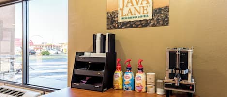A coffee shop interior with a sign reading 'JAVA LANE' and a coffee machine.